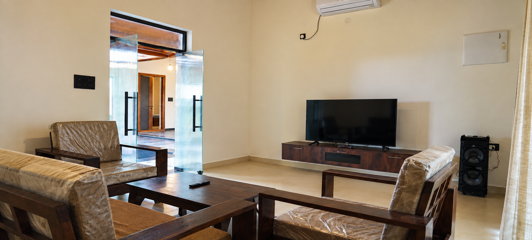Comfortable living room at Nandanavanam farmhouse in Moinabad