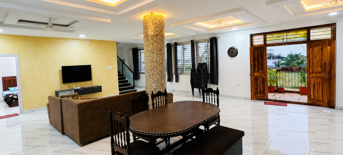 Living and dining hall at RS Farmhouse Moinabad