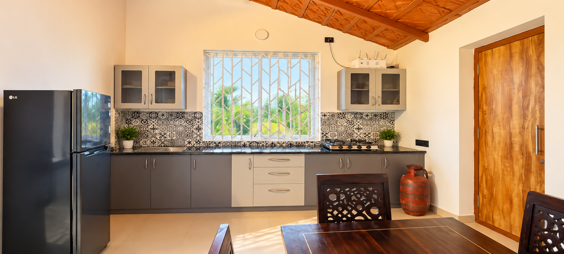 Spacious kitchen at Nandanavanam farmhouse in Moinabad with modern amenities