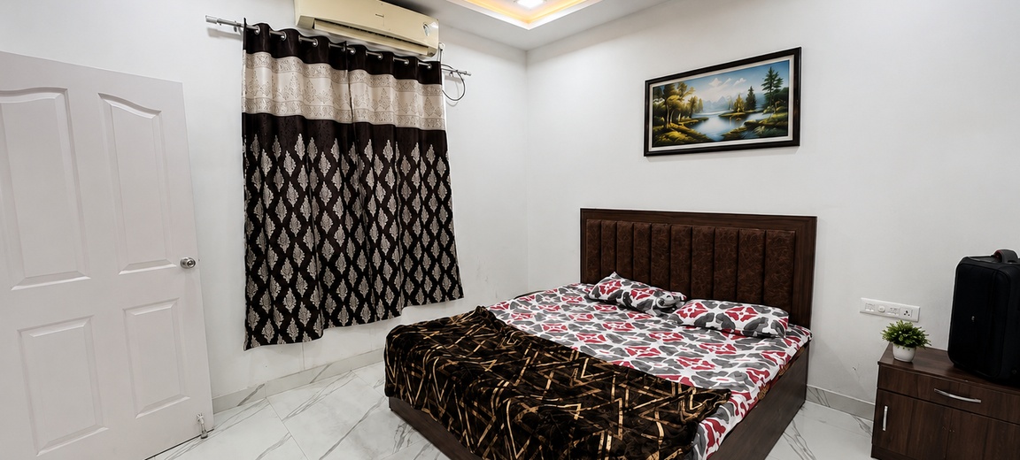 Air-conditioned bedroom at 4BHK RS Farmhouse Moinabad